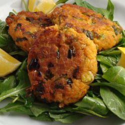 Fritters over Arugula Salad - Recipe photo by DISHINGUPDELIGHTS