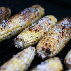 Corn with Basil Parmesan Butter - Recipe photo by theculinarycouple