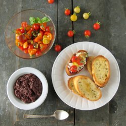 Tomato Tapenade Ricotta Crostini - Recipe photo by lastcallforcorn