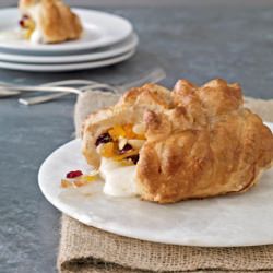 Cranberry-Apricot Baked Brie - Recipe photo by countryliving