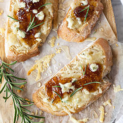 Fig Spread and Cheese Crostini - Recipe photo by FoodieCrush