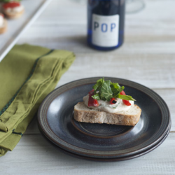 Garlic Ricotta and Arugula Crostini - Recipe photo by living to dine