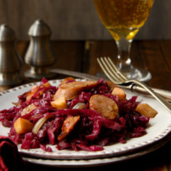 Cider Braised Cabbage and Sausage - Recipe photo by a communal table