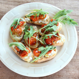 Roasted Tomato Ricotta Bruschetta - Recipe photo by Whitney Bond