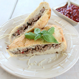 Loaded Three Cheese Calzone - Recipe photo by Whitney Bond