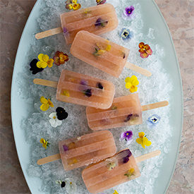 Bellini Popsicles w/ Edible Flowers - Recipe photo by honestlyyum