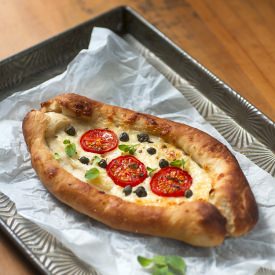 Peinirli – Greek Stuffed Bread - Recipe photo by supergoldenbakes