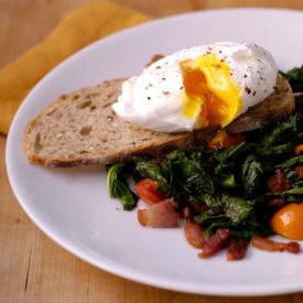 Poached Egg Over Wilted Greens - Recipe photo by SoHungryBlog