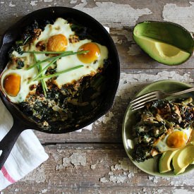 Baked Eggs with Garlic Kale - Recipe photo by Nutrition Stripped