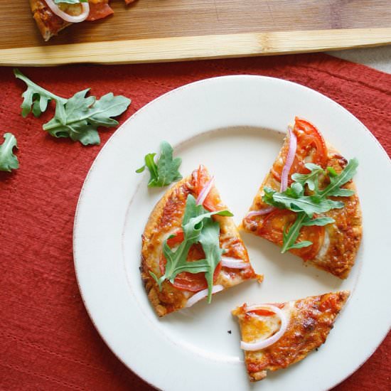 Tomato, Onion and Arugula Pizza - Recipe photo by thecravegallery