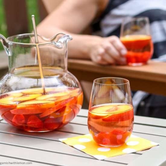 Peach Rosé Sangria - Recipe photo by garnishwithlemon