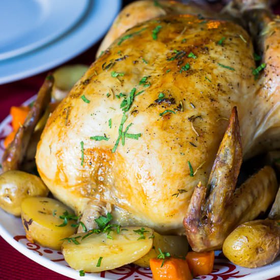 Herb Roasted Chicken with Potatoes - Recipe photo by KitchenHighlights