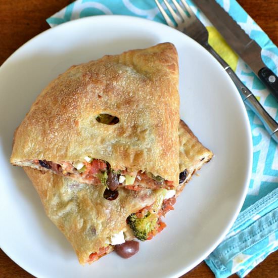 Broccoli, Feta, and Olive Calzones - Recipe photo by HelloLittleHome