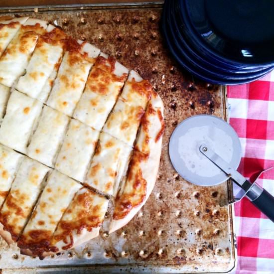Homemade Cheesy Breadsticks - Recipe photo by theginghamapron