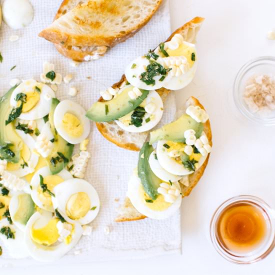 Avocado, Corn & Herb Egg Tartines - Recipe photo by kaleandcaramel