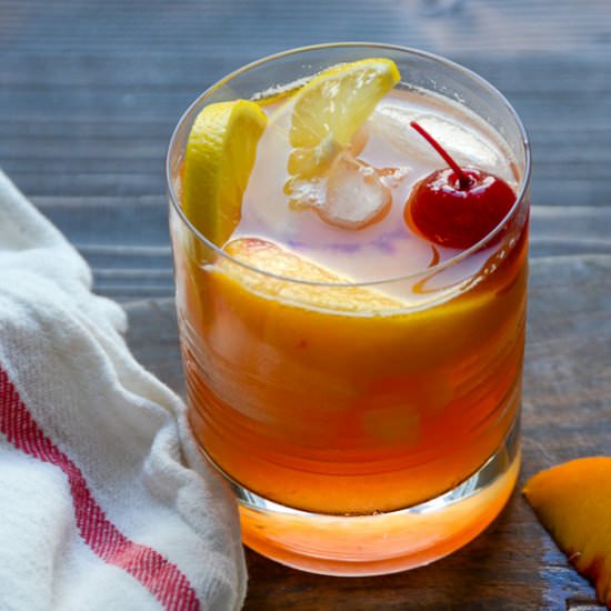 fresh peach and bourbon sour - Recipe photo by garlic and zest