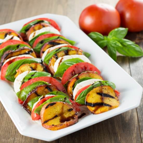 Grilled Peach Caprese Salad - Recipe photo by awholenewtwist.com
