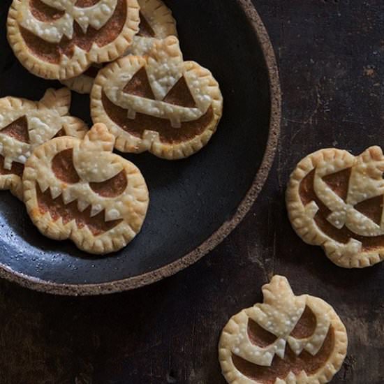 Jack-o-Lantern Pumpkin Hand Pies - Recipe photo by BakersRoyale
