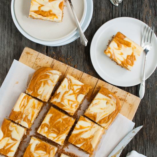 Marbled Pumpkin Cheesecake Bars - Recipe photo by tamingofthespoon