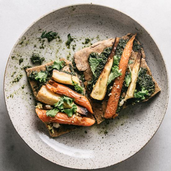 Carrot top pesto flatbread - Recipe photo by rootingthesun