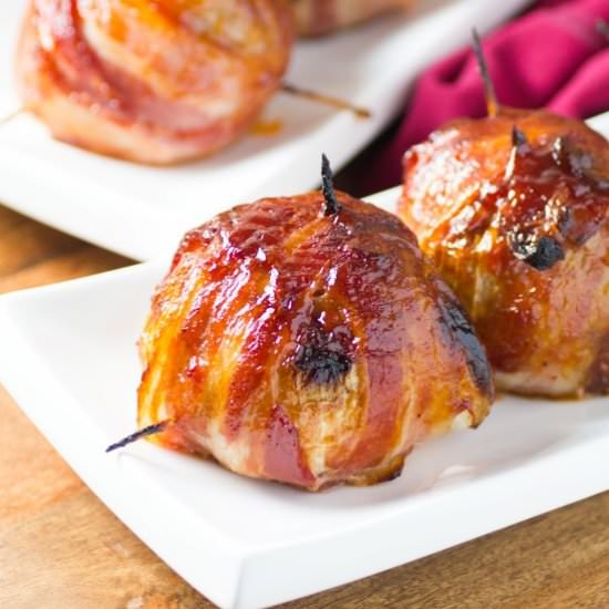 BBQ Bacon Wrapped Onion Bombs - Recipe photo by noshingwiththenolands