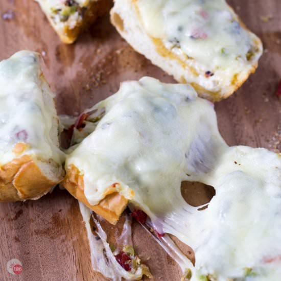 Cheesy Olive Salad French Bread - Recipe photo by Take Two Tapas