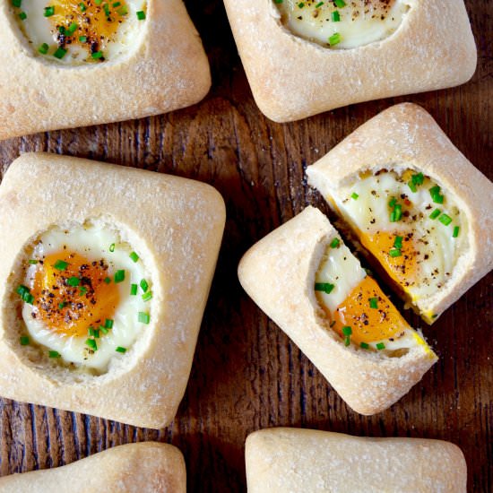 Baked Eggs in Bread Bowls - Recipe photo by justataste
