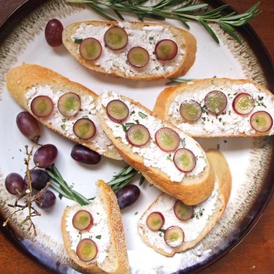 Cheese Crostini with Pickled Grapes - Recipe photo by abiteofinspiration
