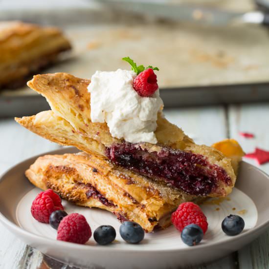 Blue Raspberry Cheesecake Turnovers - Recipe photo by DeliciouslyPlated