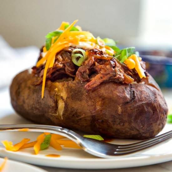 Slow Cooker BBQ Beef Stuffed Potato - Recipe photo by keviniscooking