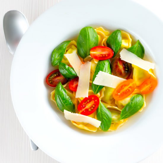Tomato Consomme with Tortellini - Recipe photo by Brian Jones