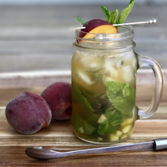 A Fresh Peach Mint Julep - Recipe photo by simmerandsauce
