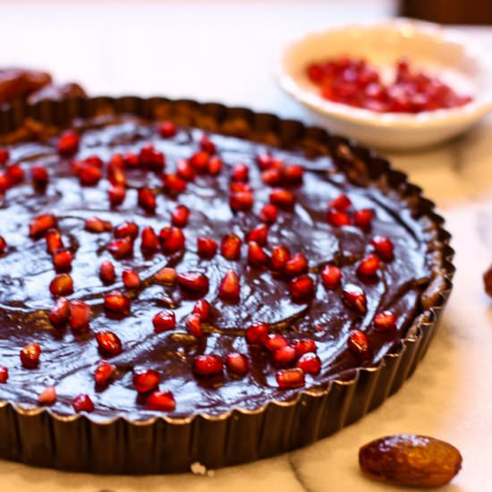 Raw Chocolate Pomegranate Tart - Recipe photo by kitchenofyouth