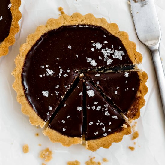 Mini Dark Chocolate Sea Salt Tarts - Recipe photo by Baked Ambrosia