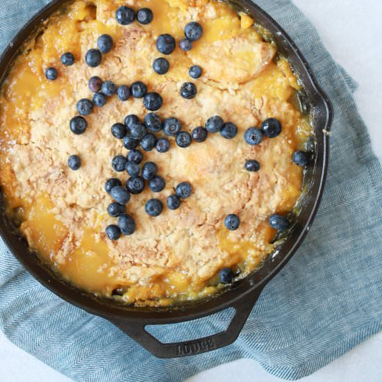 The Best Peach Cobbler - Recipe photo by Nourish Nutrition Co