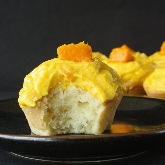 Coconut Cupcakes & Mango Frosting - Recipe photo by The Desserted Girl