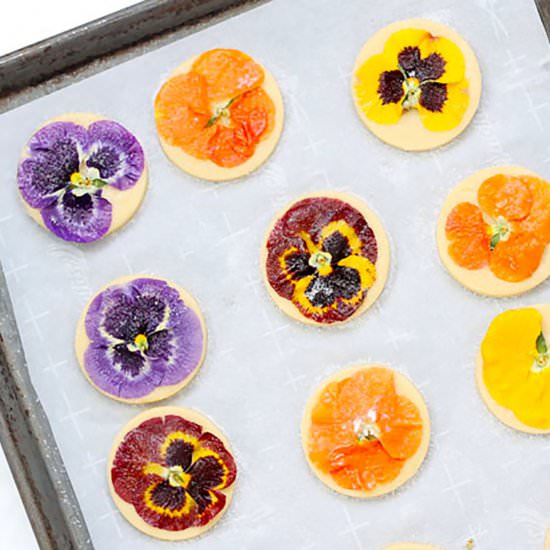 Orange Cookies with Edible Flowers - Recipe photo by FoodFanatical