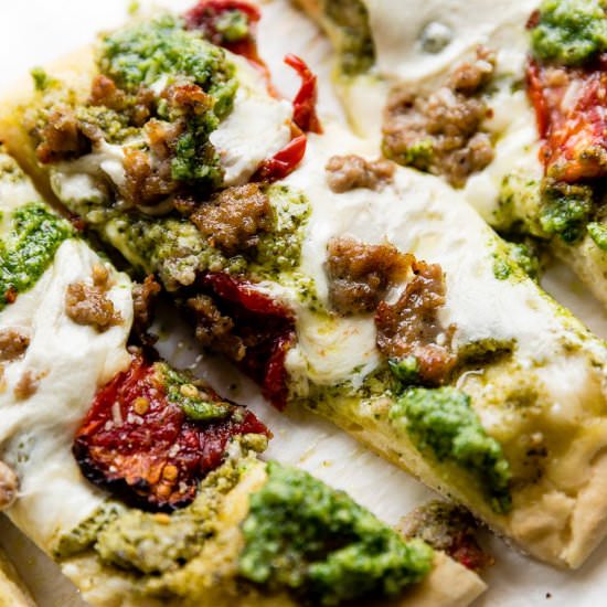 Sausage and Garlic Pesto Flatbread - Recipe photo by sallysbakingaddiction