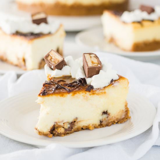 White Chocolate Snickers Cheesecake - Recipe photo by theitsybitsykitchen