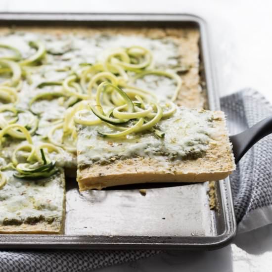 Socca Pesto Flatbread with Zoodles - Recipe photo by Inspiralized