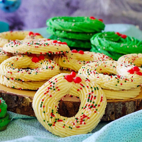 Spritz Wreath Cookies - Recipe photo by BatterandDough