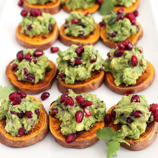 Pomegranate Guac on Sweet Potato - Recipe photo by FitLiving Eats
