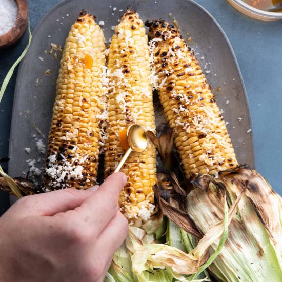Husk-on Grilled Corn with Ancho Oil - Recipe photo by TheFrayedApron