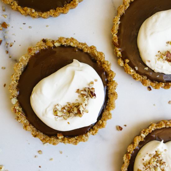 Chocolate Caramel Pecan Tarts - Recipe photo by thewoodandspoon
