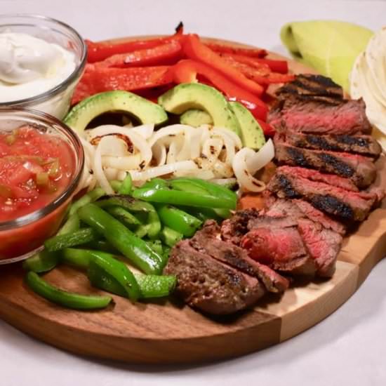 The Ultimate Sizzling Steak Fajitas - Recipe photo by Grits and Pinecones