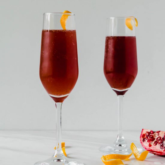 Pomegranate Sage French 75 - Recipe photo by gatheredatmytable