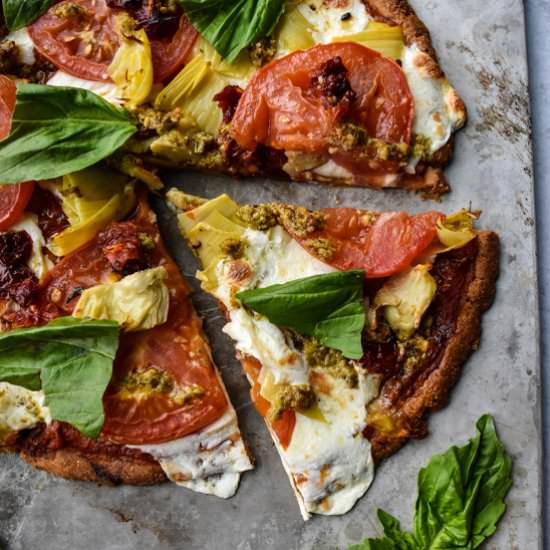 Tomato and Artichoke Pesto Pizza - Recipe photo by servingupsimplicity