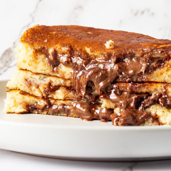 Nutella Stuffed Pancakes - Recipe photo by Foodvoyageur