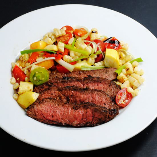 Grilled steak with corn salad - Recipe photo by white plate blank slate