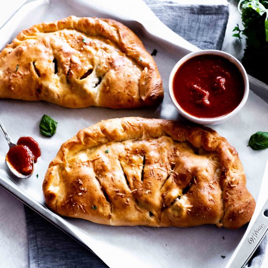 pepperoni and mushroom calzones - Recipe photo by whisked away kitchen